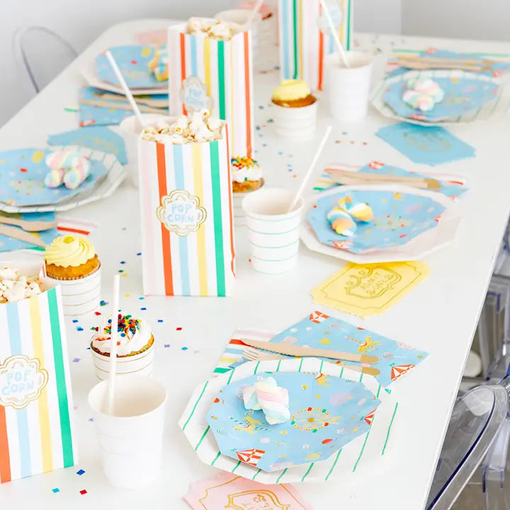 Colorful striped favor bags and carnival themed tableware for fair celebration from Parte Haus party supply store in Bethesda Maryland