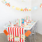 Red and white circus themed large plates on a decorated birthday table from Parte Haus party supply store in Bethesda MD