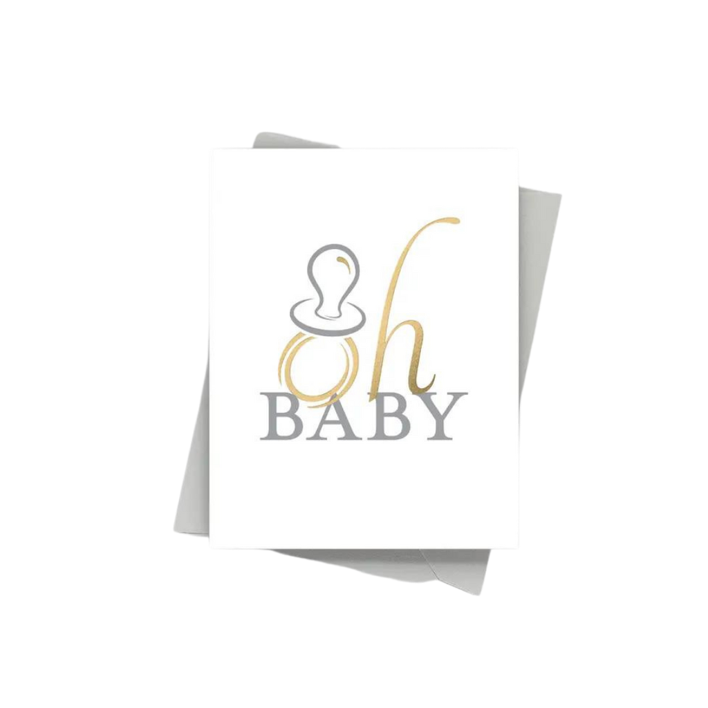 White and gold baby shower announcement card with pacifier from Parte Haus party supply store in Bethesda MD