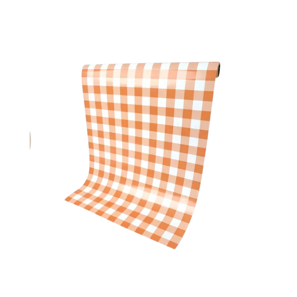 Orange gingham paper table runner with checkered pattern for picnic decor from Parte Haus party supply store in Bethesda MD.
