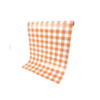 Orange gingham paper table runner with checkered pattern for picnic decor from Parte Haus party supply store in Bethesda MD.
