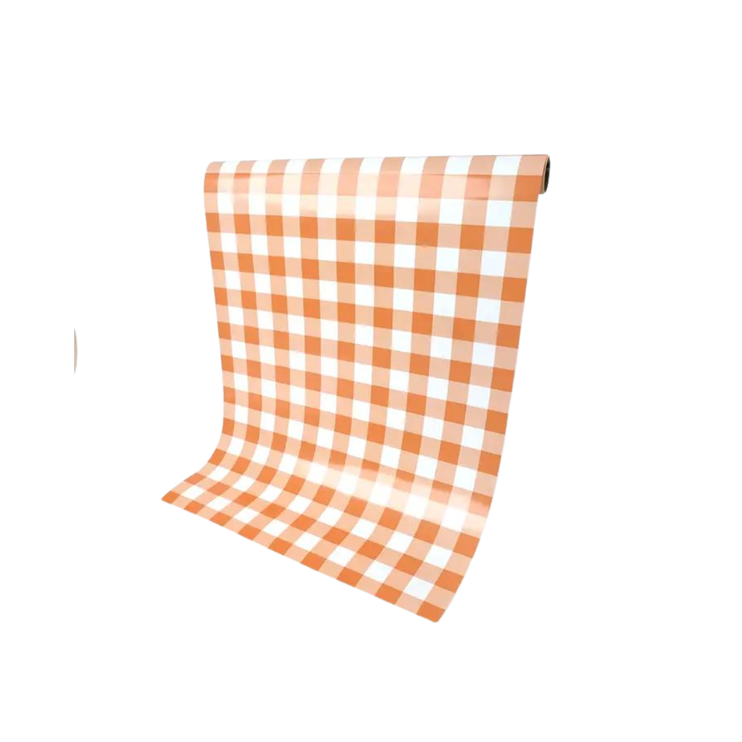 Orange gingham paper table runner with checkered pattern for picnic decor from Parte Haus party supply store in Bethesda MD.