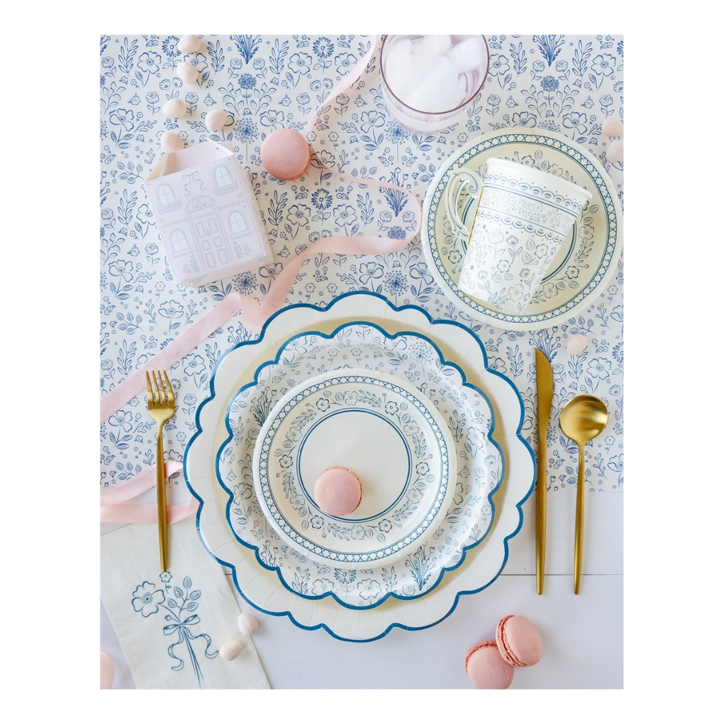 Blue and white floral plate set with gold cutlery and macarons tea party tableware from Parte Haus party supply store in Bethesda Maryland