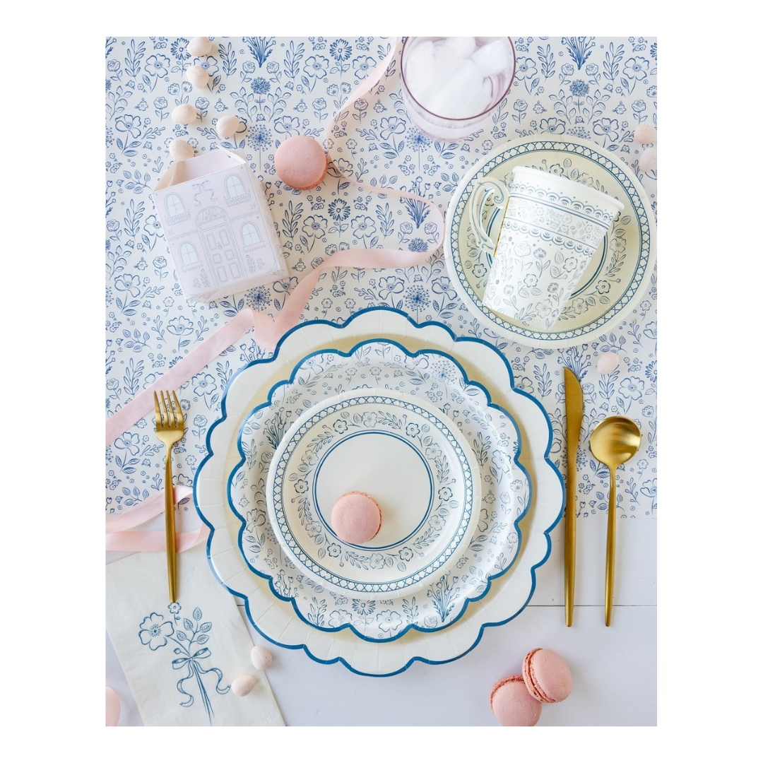 Blue and white floral plate set with gold cutlery and macarons tea party tableware from Parte Haus party supply store in Bethesda Maryland
