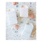 Pastel blue and pink house shaped treat boxes with illustrated windows and doors birthday baby shower from Parte Haus party supply store in Bethesda Maryland