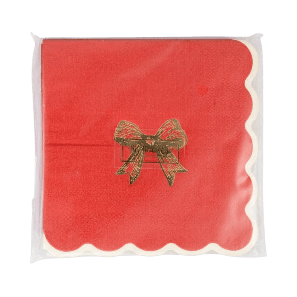 Red napkin with gold bow and scalloped edge for Christmas from Parte Haus party supply store in Bethesda MD