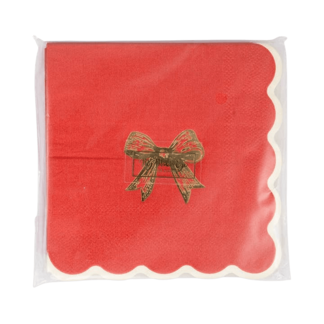 Red napkin with gold bow and scalloped edge for Christmas from Parte Haus party supply store in Bethesda MD