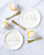 White oh baby plates with gold script and cupcakes for baby shower from Parte Haus party supply store in Bethesda MD