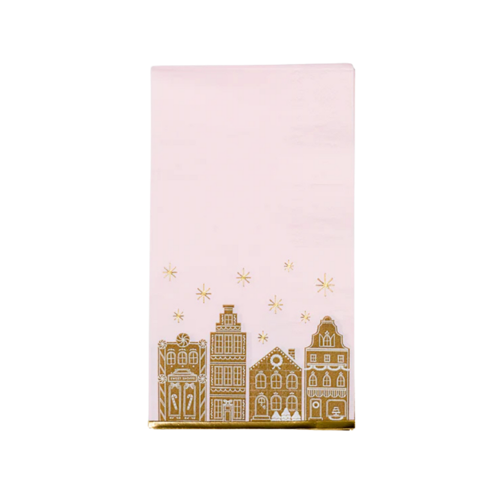 Pink gingerbread guest towel with gold village and stars holiday design from Parte Haus party supply store in Bethesda MD