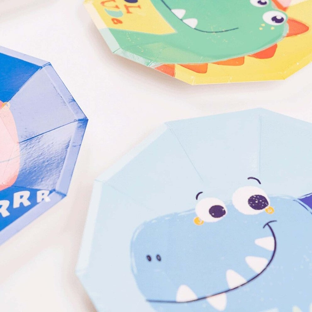 Blue and green dinosaur plate with cute cartoon face for kids birthday from Parte Haus party supply store in Bethesda MD
