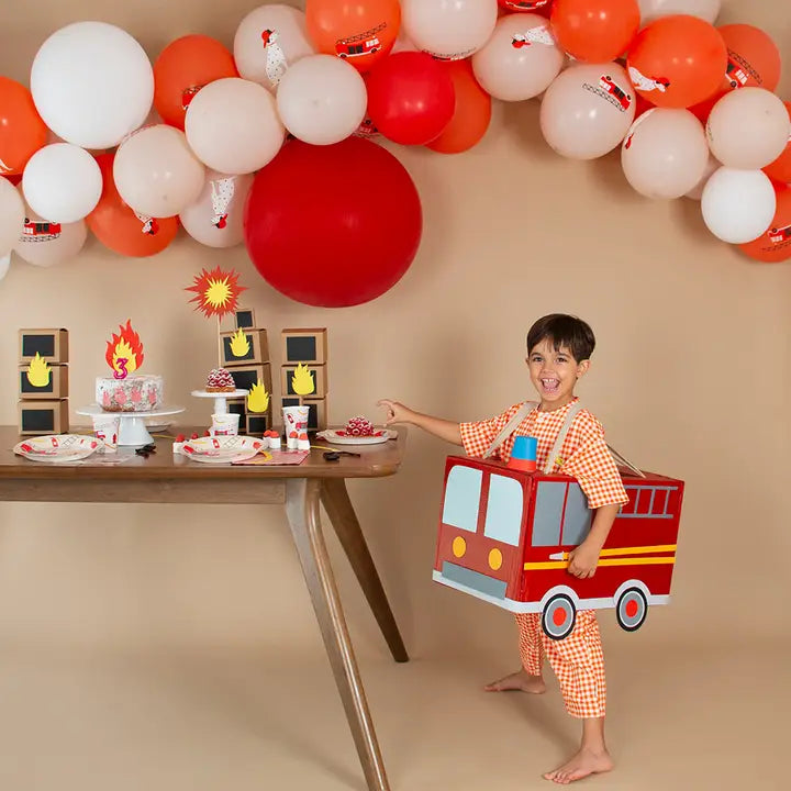 Red and orange firefighter party plates with firetruck design kids birthday theme from Parte Haus party supply store in Bethesda Maryland