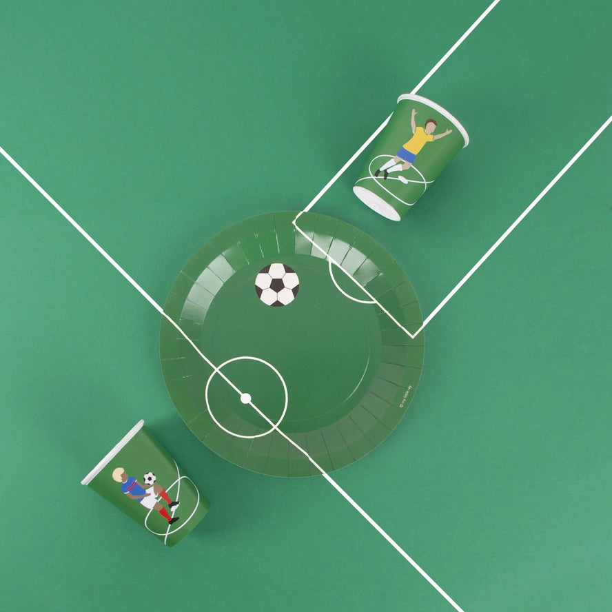 Green soccer plate and cups with cartoon players soccer birthday theme from Parte Haus party supply store in Bethesda MD
