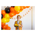 Orange and yellow construction birthday balloon arch and cone banner kids party theme from Parte Haus party supply store in Bethesda MD