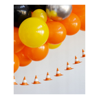 Yellow orange and silver balloon arch with traffic cone garland for construction birthday from Parte Haus party supply store in Bethesda Maryland