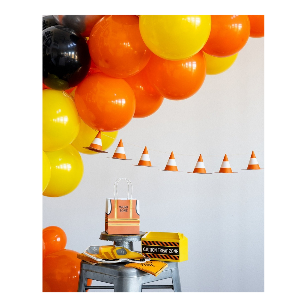 Orange and yellow construction themed decoration set with balloons and cones for birthday from Parte Haus party supply store in Bethesda Maryland
