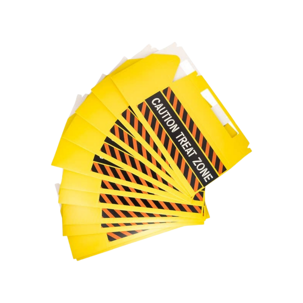 Yellow caution treat zone favor boxes with black stripes for Halloween from Parte Haus party supply store in Bethesda MD