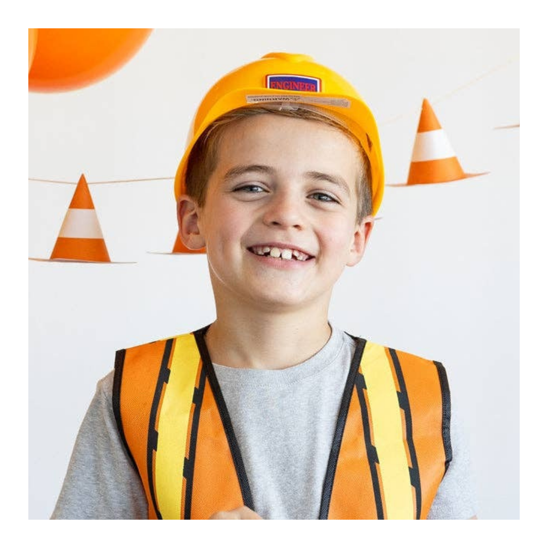 Orange kids construction vest and hard hat with cone banner construction birthday from Parte Haus party supply store in Bethesda Maryland