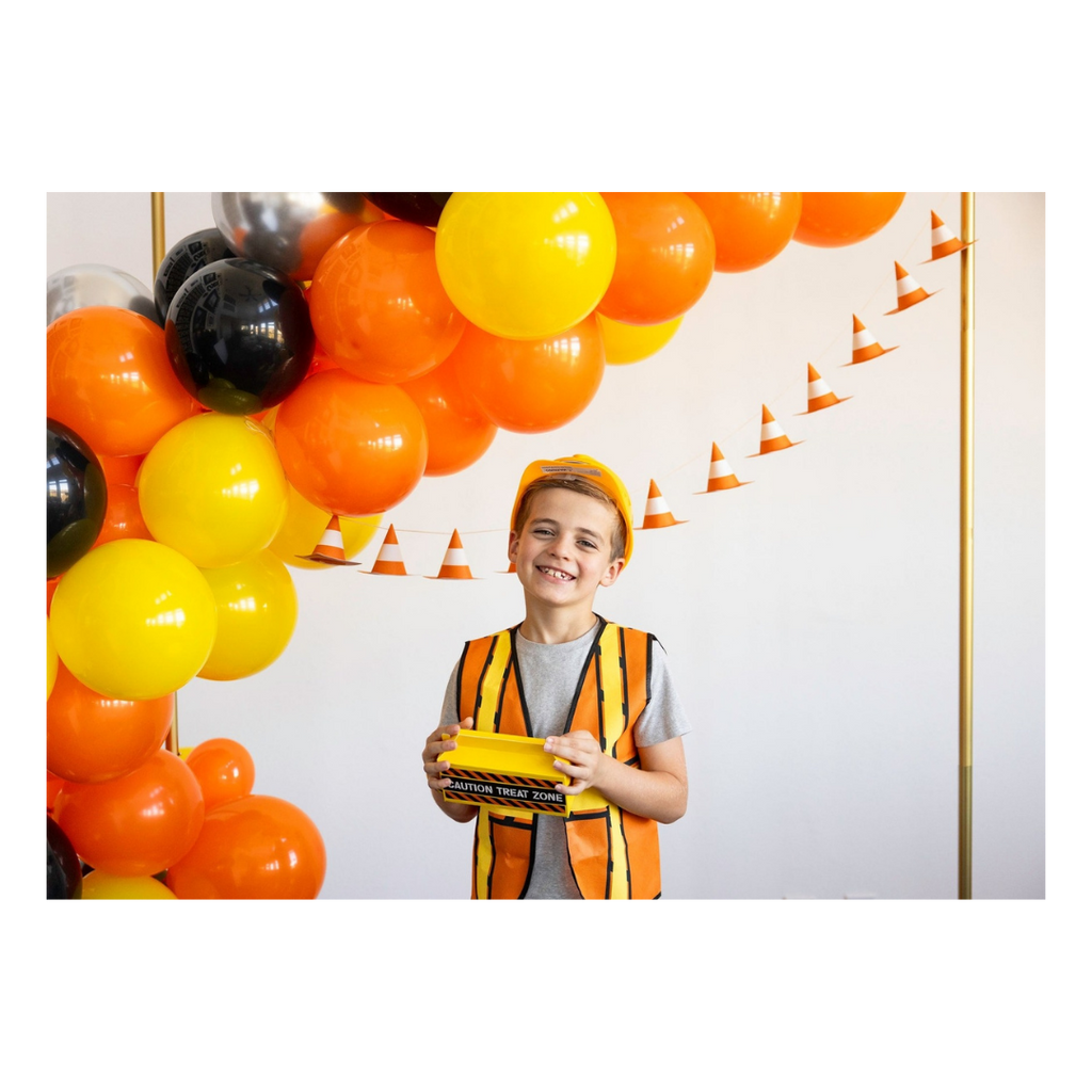 orange and yellow construction theme balloon arch kid in vest and hard hat birthday from Parte Haus party supply store in Bethesda MD