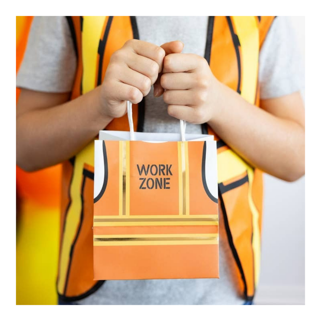 Orange construction goodie bag with work zone sign for kids birthday from Parte Haus party supply store in Bethesda MD