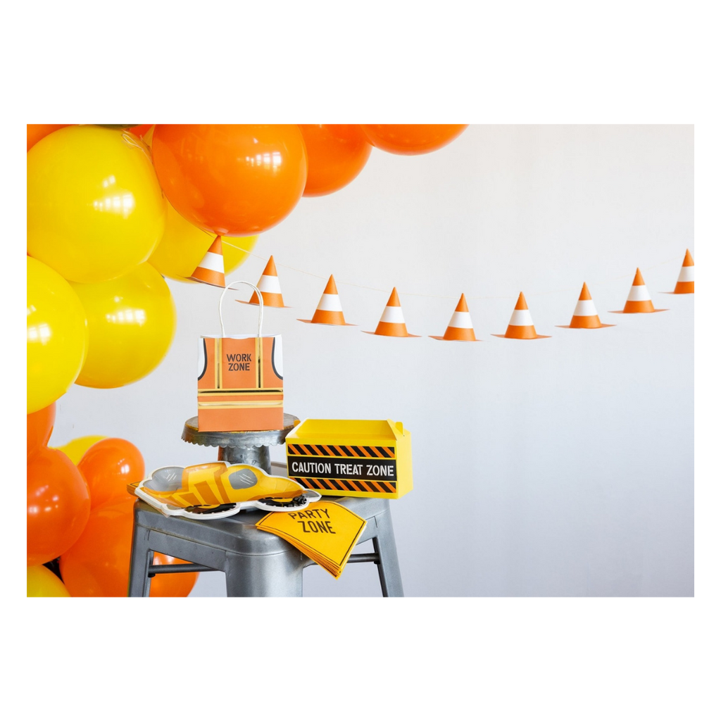 Yellow and orange construction theme decorations with balloons cones treat boxes from Parte Haus party supply store in Bethesda MD