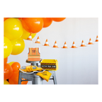 Yellow and orange construction theme decorations with balloons cones treat boxes from Parte Haus party supply store in Bethesda MD