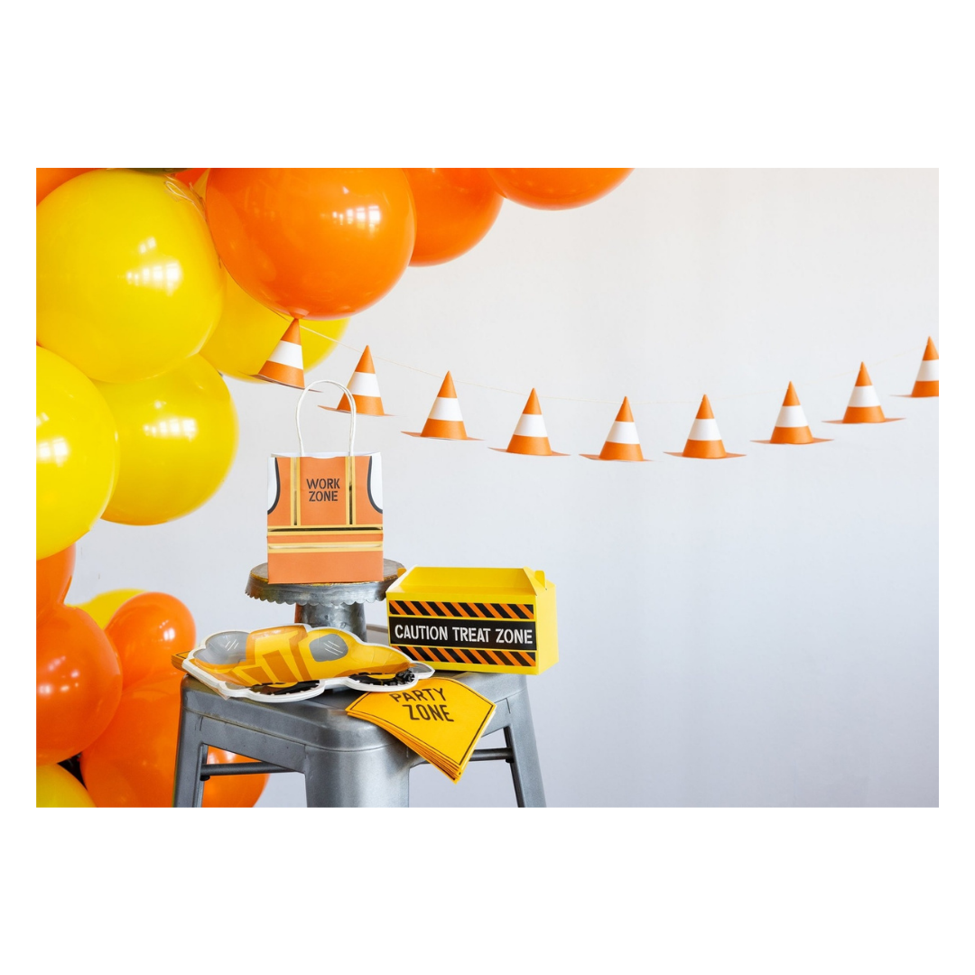 Yellow and orange construction theme decorations with balloons cones treat boxes from Parte Haus party supply store in Bethesda MD