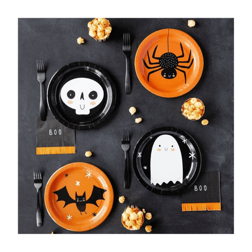 Orange and black Halloween themed paper plates with skeleton spider ghost and bat design from Parte Haus party supply store in Bethesda Maryland
