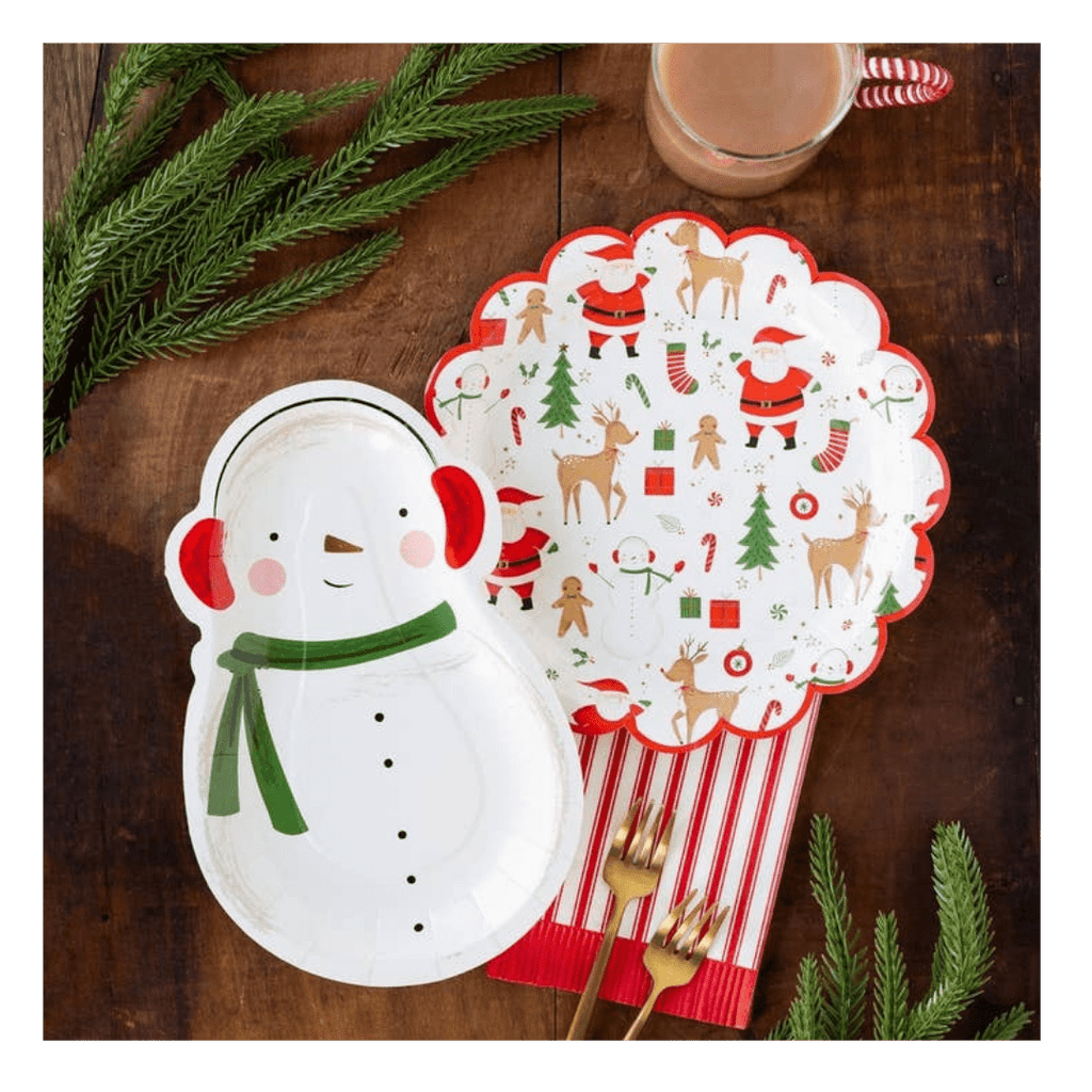 White snowman and festive Christmas paper plates with holiday designs from Parte Haus party supply store in Bethesda MD