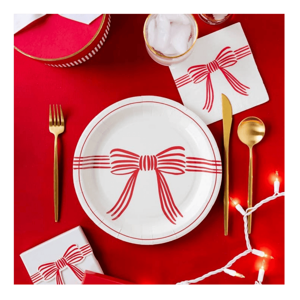 Red and white bow plate with matching napkin holiday tableware from Parte Haus party supply store in Bethesda MD