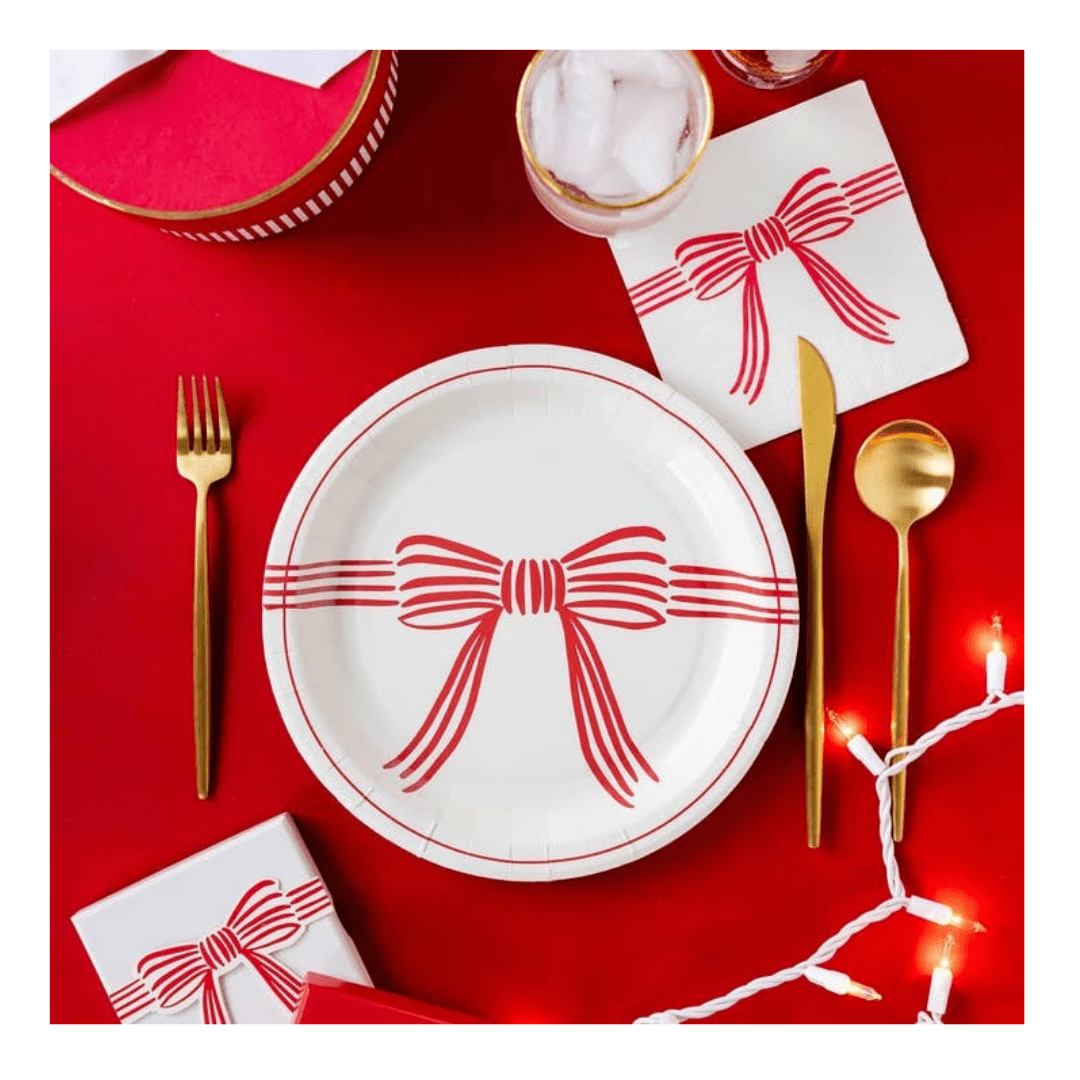 Red and white bow plate with matching napkin holiday tableware from Parte Haus party supply store in Bethesda MD