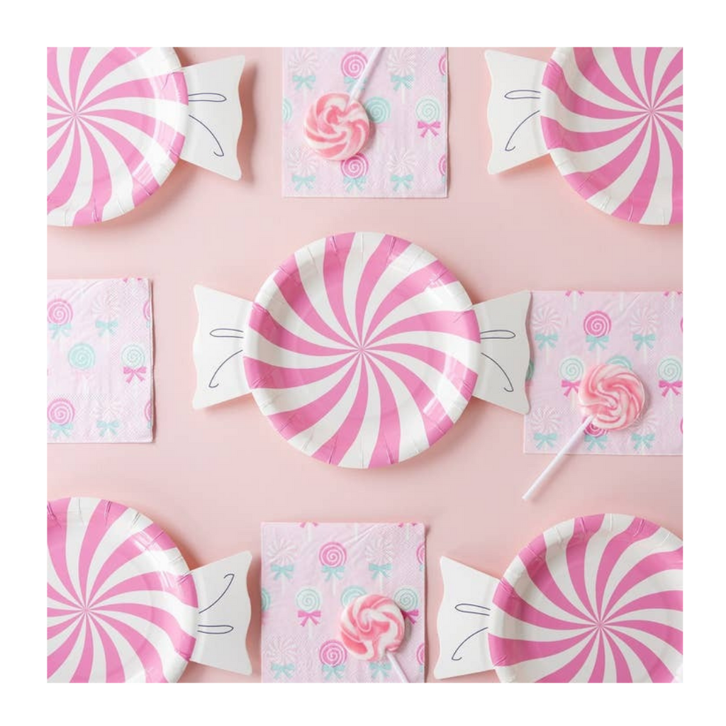 Pink swirl candy paper plates and matching napkins with lollipops for birthday from Parte Haus party supply store in Bethesda Maryland