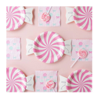 Pink swirl candy paper plates and matching napkins with lollipops for birthday from Parte Haus party supply store in Bethesda Maryland