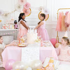 Pink princess happy birthday banner with girls in pastel dresses at party from Parte Haus party supply store in Bethesda, MD.