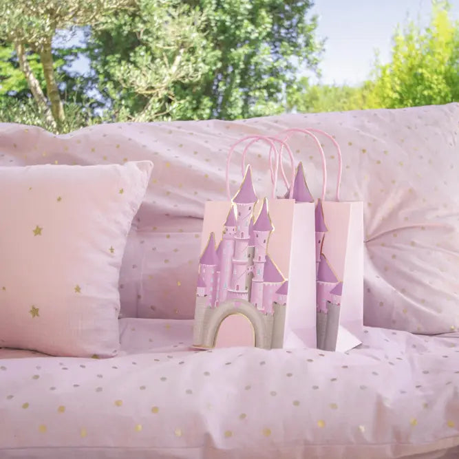 Pink castle gift bags with gold accents for princess birthday from Parte Haus party supply store in Bethesda MD
