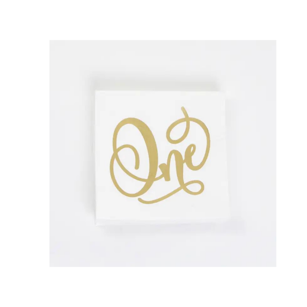 White and gold One paper napkin for first birthday from Parte Haus party supply store in Bethesda MD