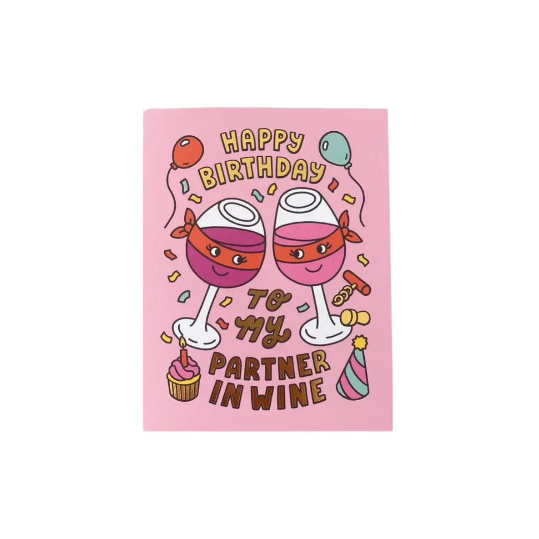 Pink birthday card with cartoon wine glasses balloons cupcake from Parte Haus party supply store in Bethesda MD