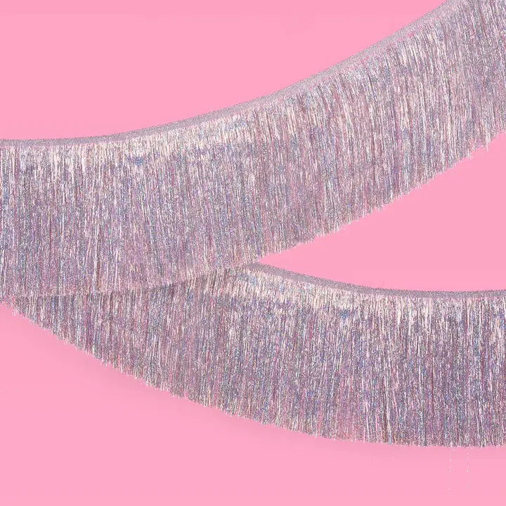 Iridescent fringe foil banner shimmer streamers for birthday decor from Parte Haus party supply store in Bethesda MD