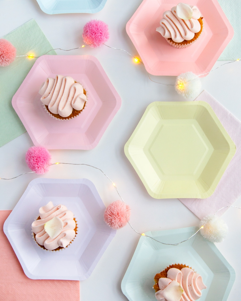 Pastel dinner napkins and plates with frosted cupcakes birthday celebration from Parte Haus party supply store in Bethesda MD