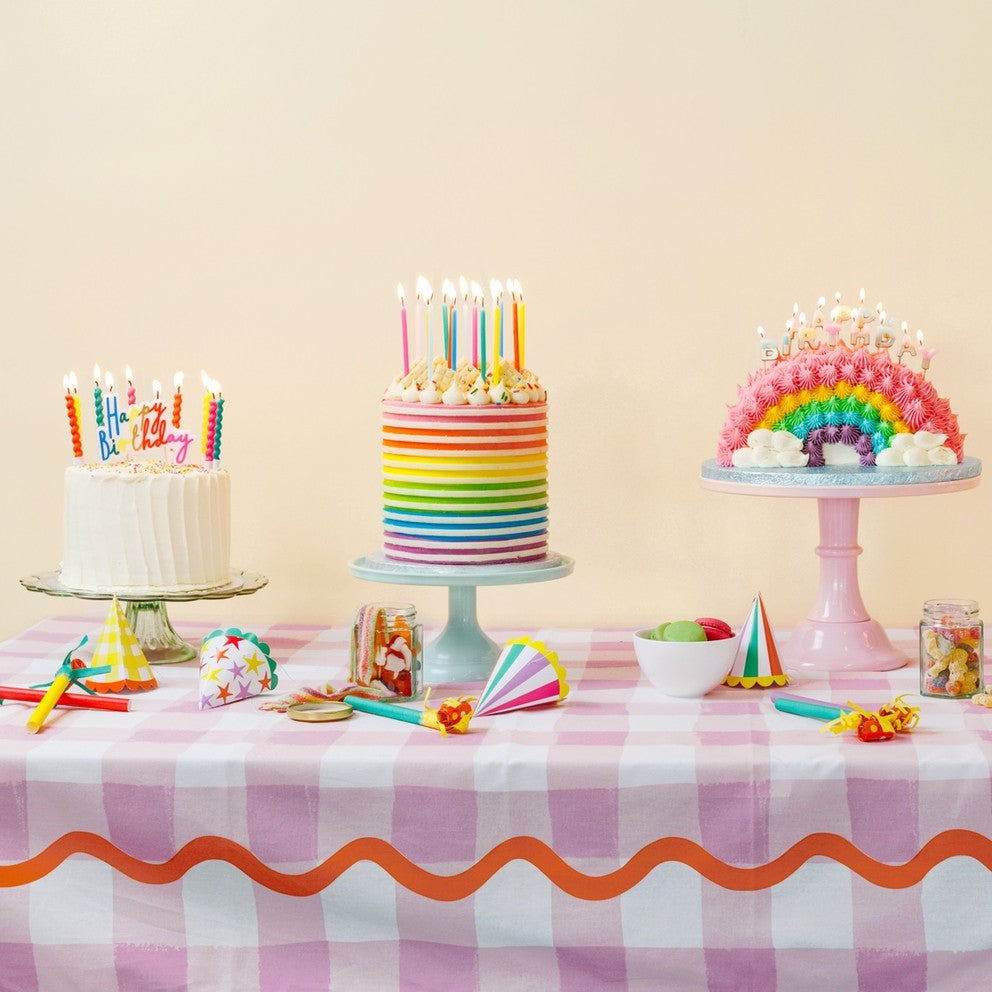 Pastel twisted birthday candles on colorful cakes for birthday from Parte Haus party supply store in Bethesda Maryland