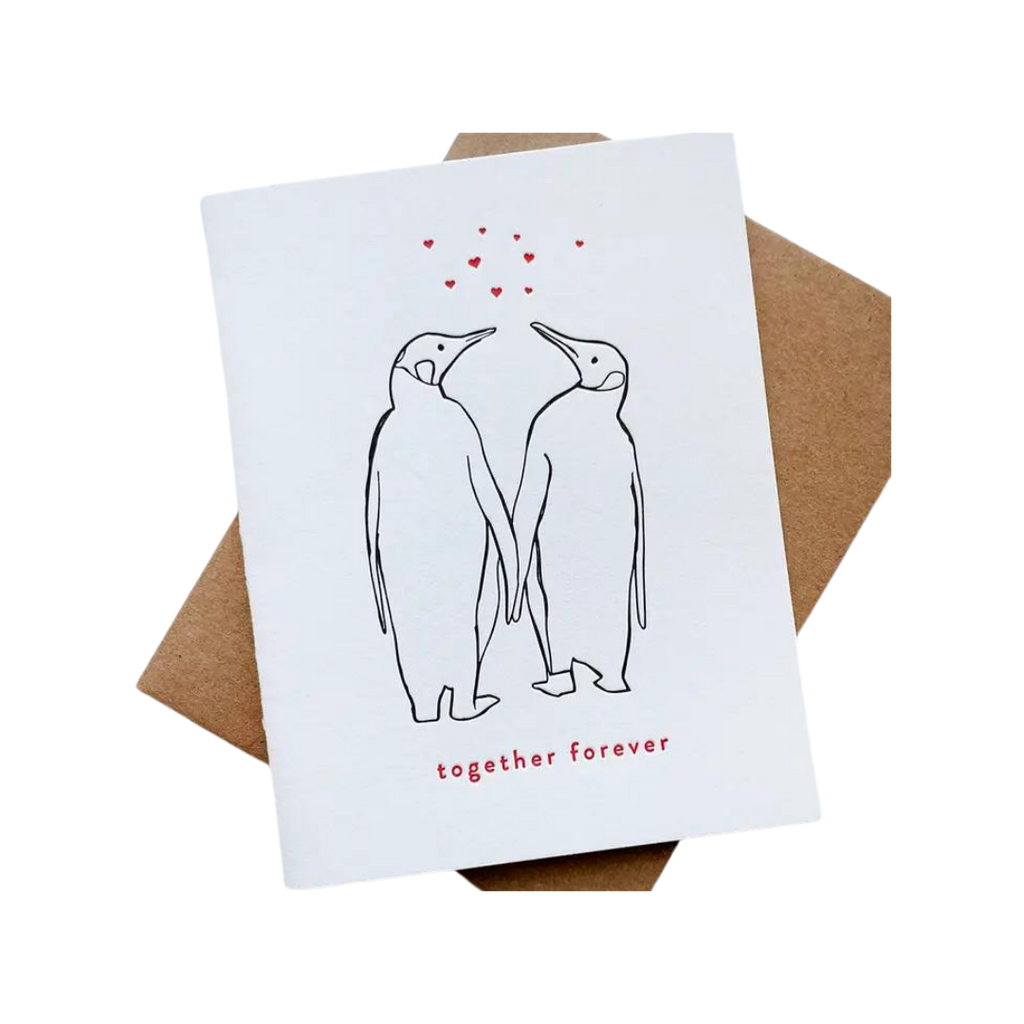 White love anniversary card with two penguins holding hands Valentine design from Parte Haus party supply store in Bethesda Maryland