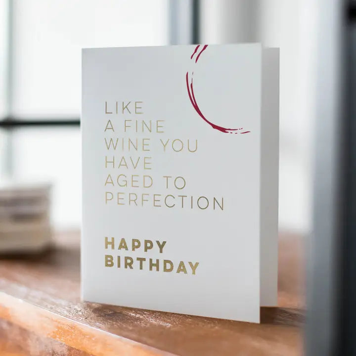 white birthday greeting card with gold text and wine stain print birthday theme from Parte Haus party supply store in Bethesda MD