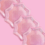 Pink foil starburst plates with glitter edges for birthday or bachelorette from Parte Haus party supply store in Bethesda MD