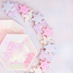 Pink frosted small appetizer dessert plates with snowflake design for winter parties from Parte Haus party supply store in Bethesda MD
