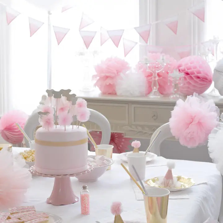 Pink table cover with Barbie themed decorations and cake for birthday from Parte Haus party supply store in Bethesda MD