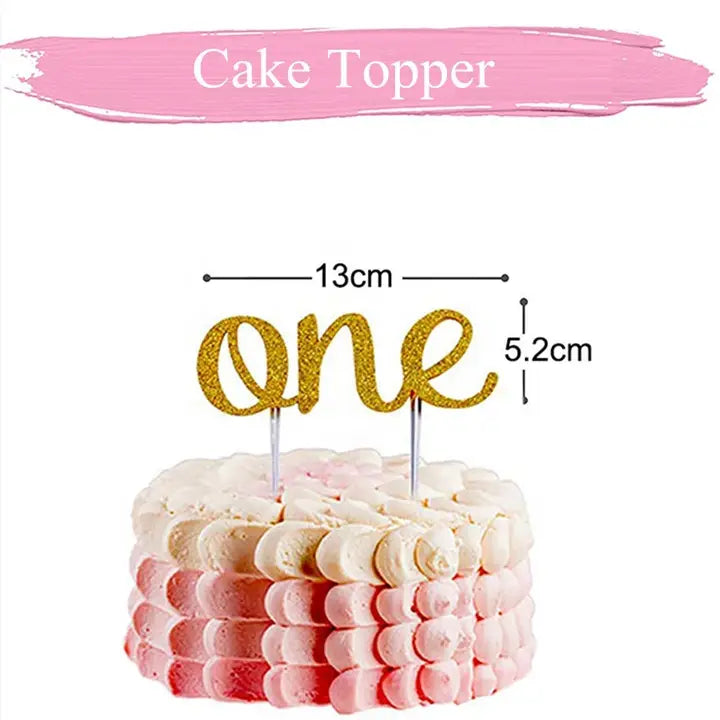 Pink cake topper with gold glitter one text for first birthday from Parte Haus party supply store in Bethesda MD