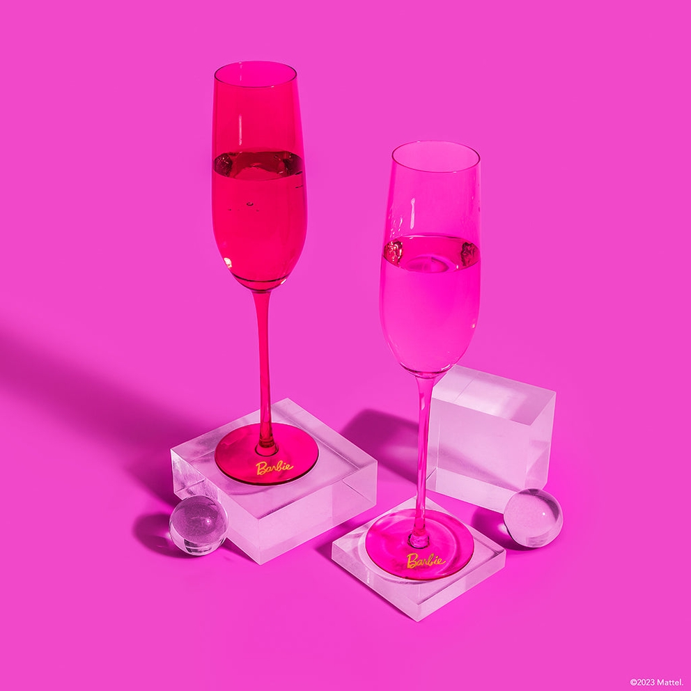 Pink Barbie champagne flutes with clear bases for celebration theme from Parte Haus party supply store in Bethesda MD