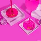 Pink Barbie champagne flutes with clear bases for celebration theme from Parte Haus party supply store in Bethesda Maryland