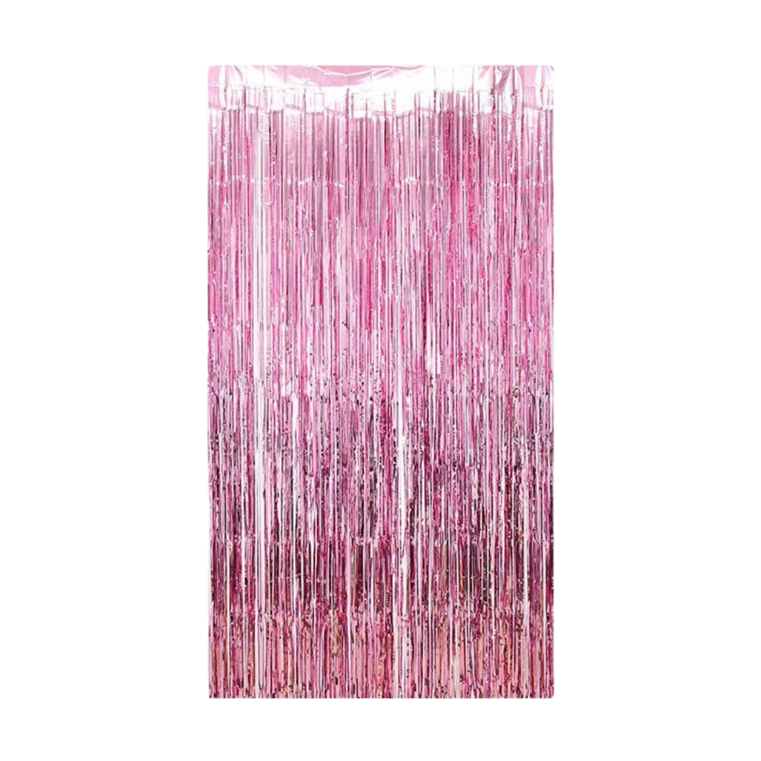 Pink metallic fringe tinsel curtain backdrop for birthday celebration from Parte Haus party supply store in Bethesda MD