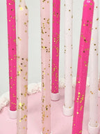 Pink tones gold glitter candles on cake birthday celebration from Parte Haus party supply store in Bethesda Maryland