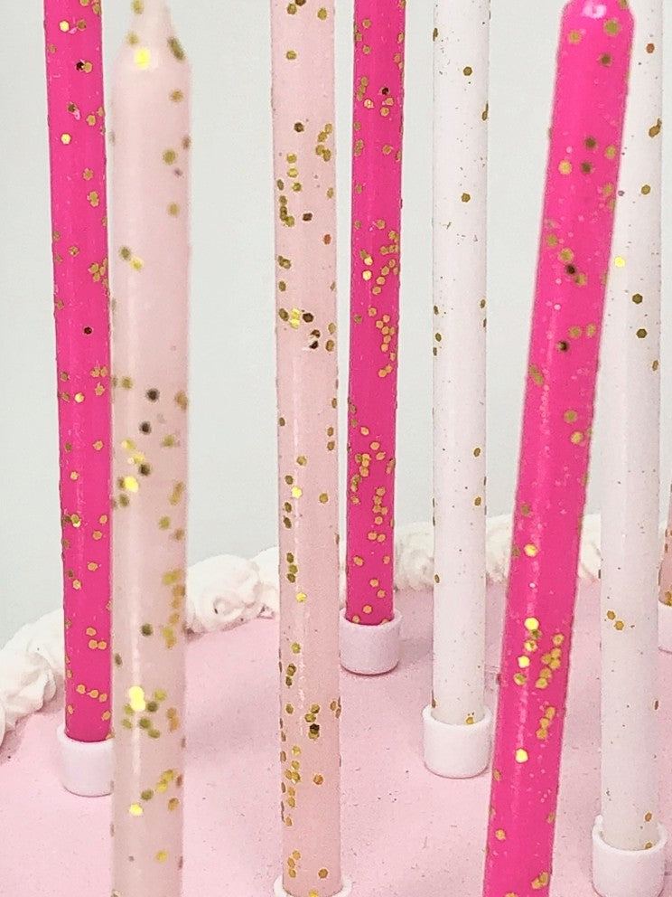 Pink tones gold glitter candles on cake birthday celebration from Parte Haus party supply store in Bethesda Maryland